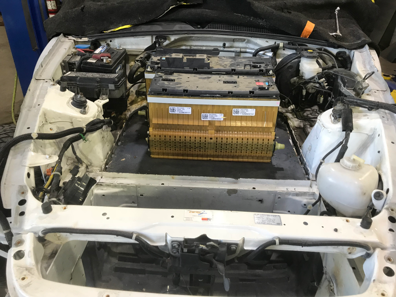 Installing batteries under the hood.